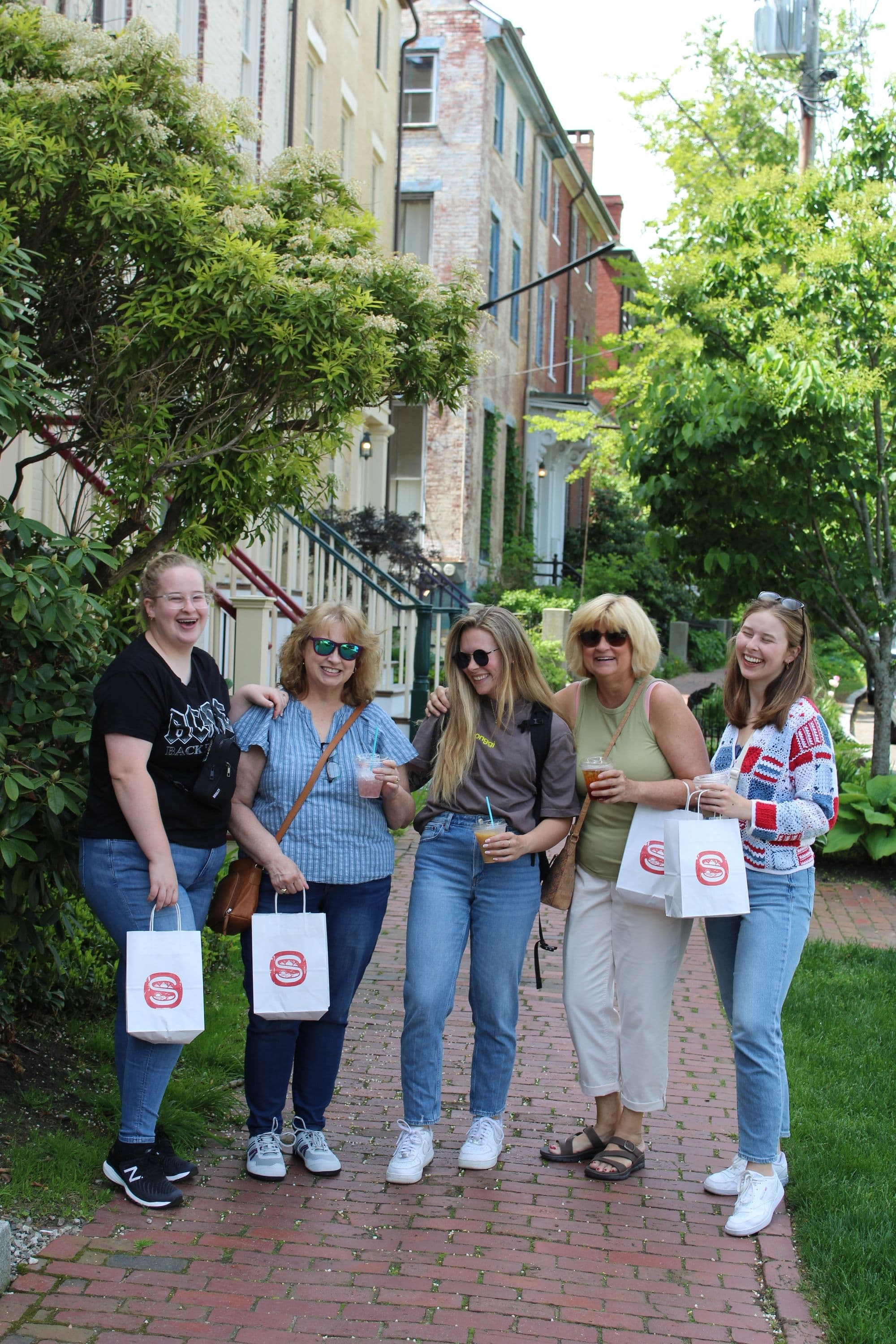 women laughing during a bakery crawl in Portland, ME